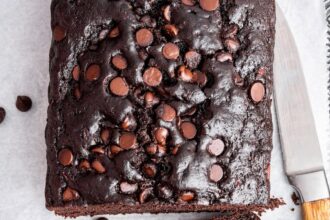 Two slices of chocolate zucchini bread on a large baking tray.