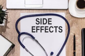 The words side effects on a piece of paper on a doctor