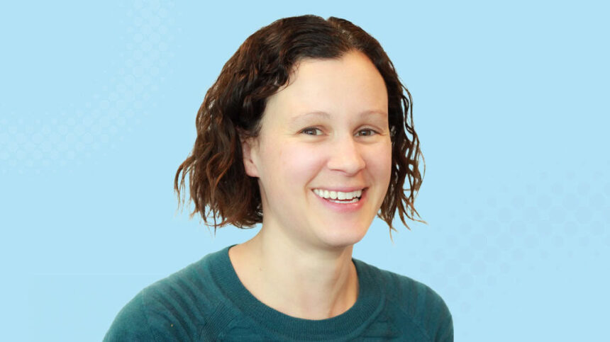 A smiling young female researcher, Dr Evelyn Parr, is shown against a blue background.