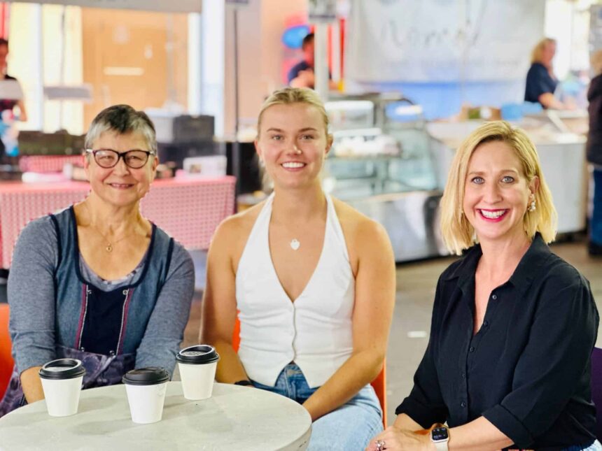 CDE Jane Giles, Molly Brooksby and Justine Cain sit at a table in Adelaide having coffees.